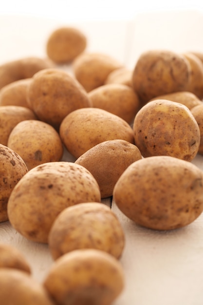 Rustic unpeeled potatoes on a table