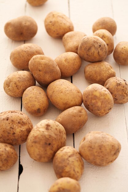 Rustic unpeeled potatoes on a table