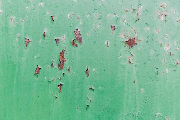 Free photo rusty red and scratched green wall