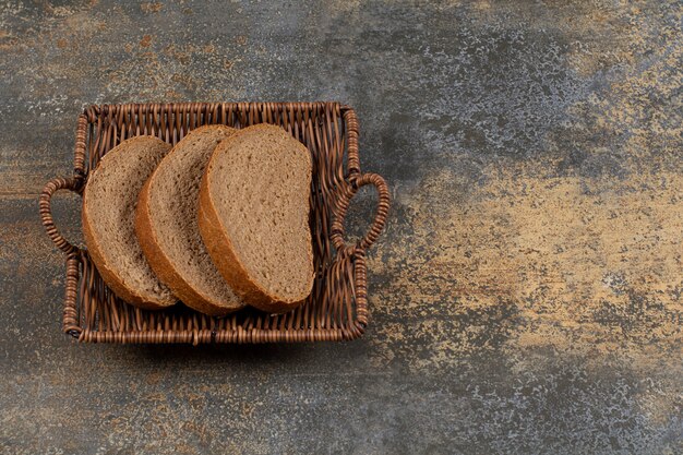 Rye bread slices in wooden basket