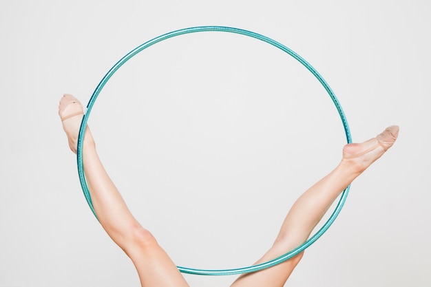 Rythmic gymnast posing with the hoop