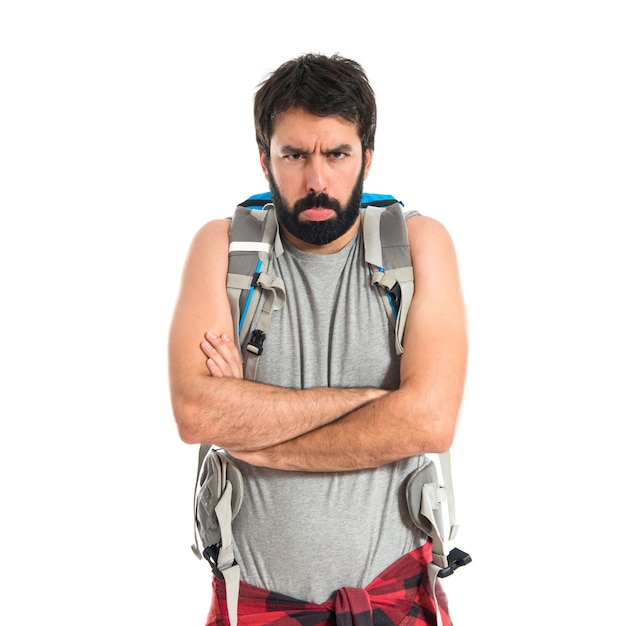 Sad backpacker over isolated white background