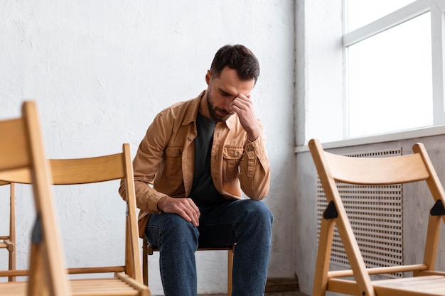 Sad man at a group therapy session