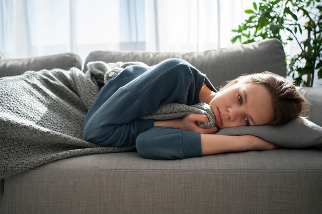 Sad young woman at home