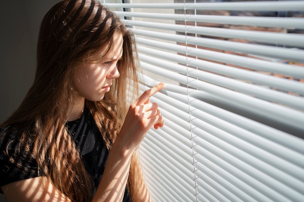 Sad young woman at home