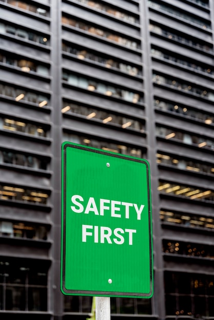 Safety first sign  in front of building