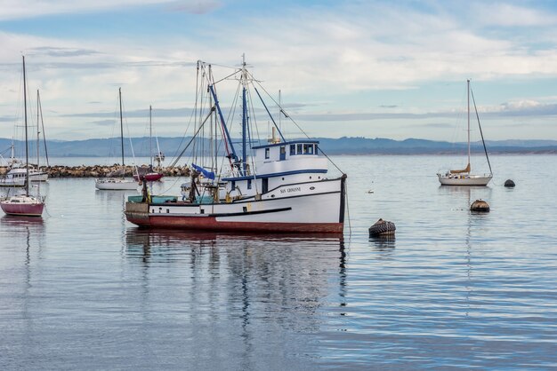 Free Photo sailing boats on the water near old fisherman's wharf captured in monterey, united states