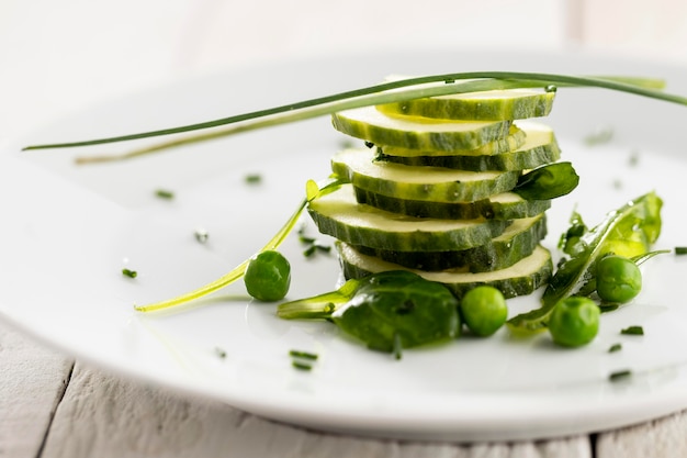 Free photo salad of cucumbers on a white plate