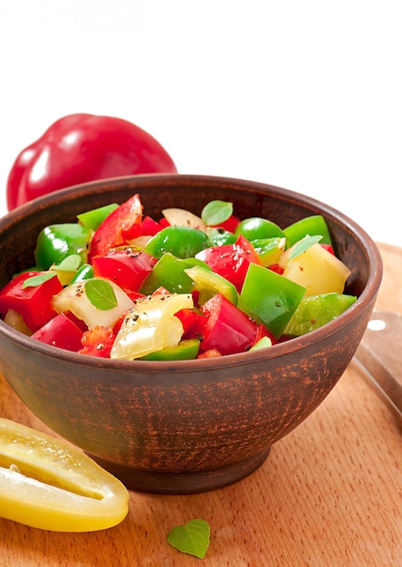 Free photo salad of sweet colorful peppers with olive oil