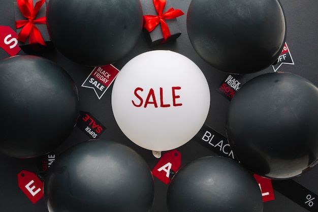 Free Photo sale concept surrounded by black balloons