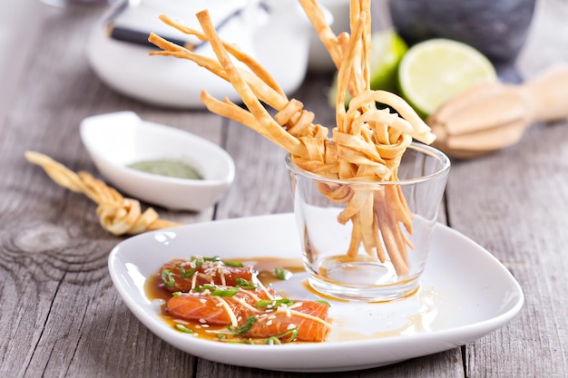 Salmon sashimi with udon noodle knots