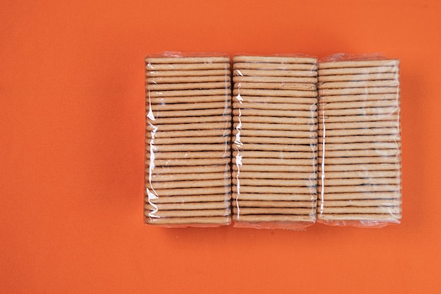 Salt crackers on the orange background