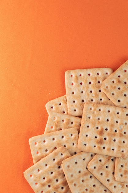 Free Photo salt crackers on the orange table