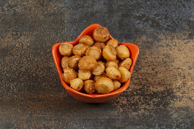 Salted tasty crackers in star shaped bowl. 