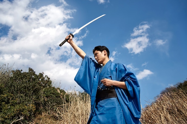 Samurai with sword outdoors