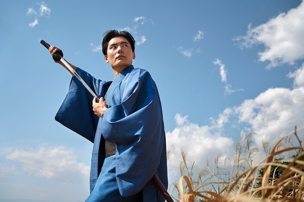 Free Photo samurai with sword outdoors