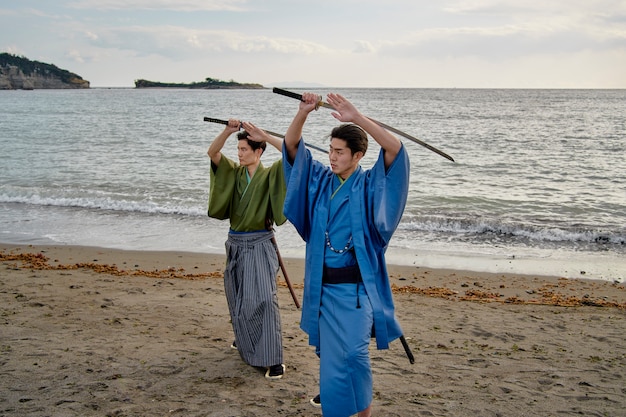 Free photo samurais at the beach