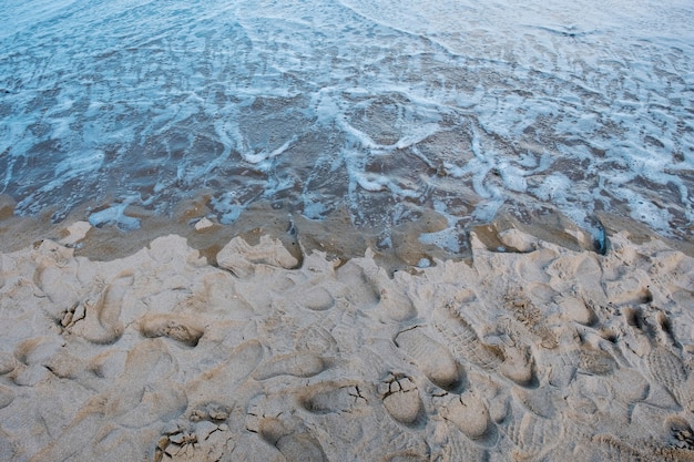 Free Photo sand footprint and sea