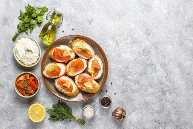 Sandwiches with smoked salmon and cream cheese and dill.