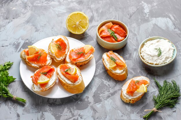 Sandwiches with smoked salmon and cream cheese and dill.