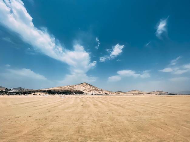 Free Photo sandy hill under cloudy sky