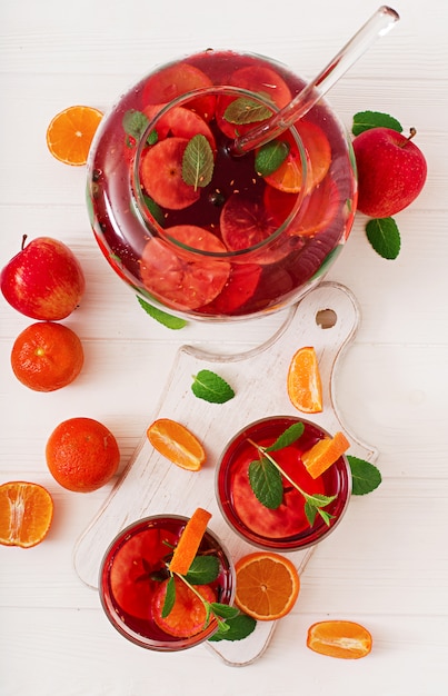 Free photo sangria with fruits and mint on a white