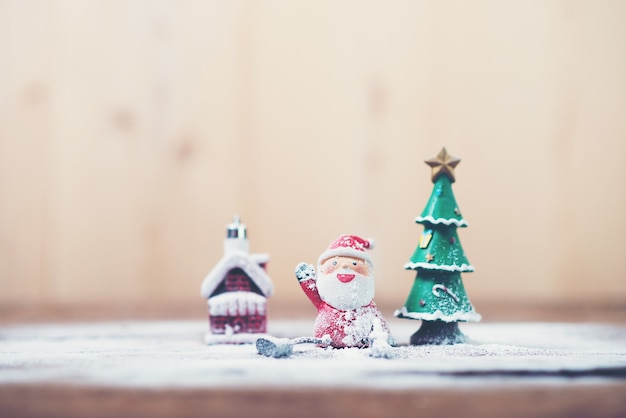 Free Photo santa claus and christmas tree with snow