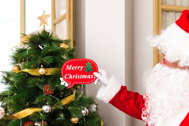 Free Photo santa claus greeting with christmas