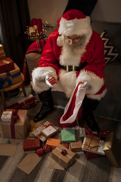 Free Photo santa claus preparing his bag of gifts