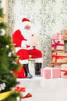 Free photo santa claus reading wish list