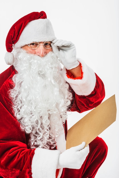 Santa Claus with children list in hand