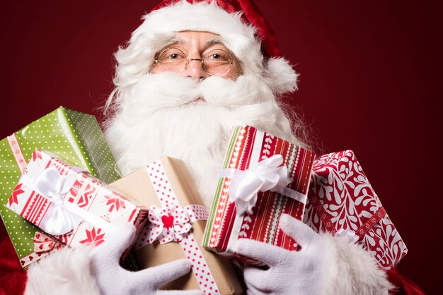 Santa Claus with a lot of gift boxes