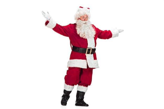 Santa Claus with a Luxurious White Beard, Santa's Hat and a Red Costume isolated on a White Background