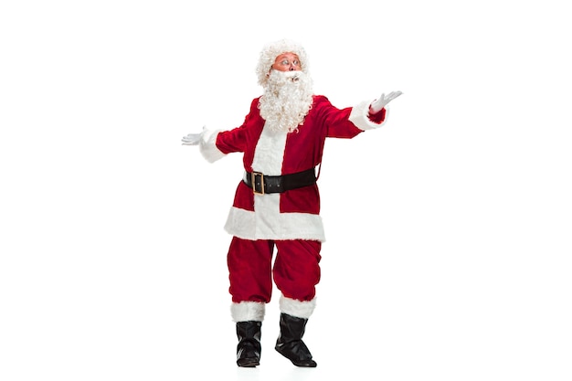 Free Photo santa claus with a luxurious white beard, santa's hat and a red costume isolated on a white background