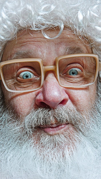 Free Photo santa claus with surprised expression.