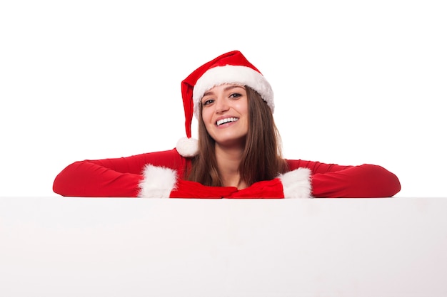 Santa girl leaning on blank board