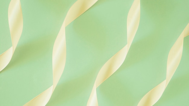 Satin ribbon decoration on green background