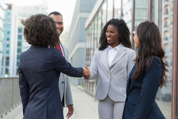 Satisfied business partners finishing up successful meeting