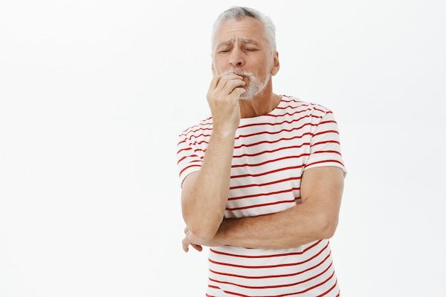 Satisfied old man on vacation compliment delicious food, react to perfection