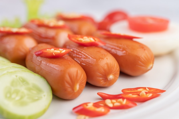 Sausage placed on a white plate.