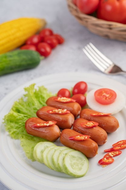 Sausage placed on a white plate.