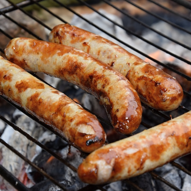 Free photo sausage roasting on the barbecue