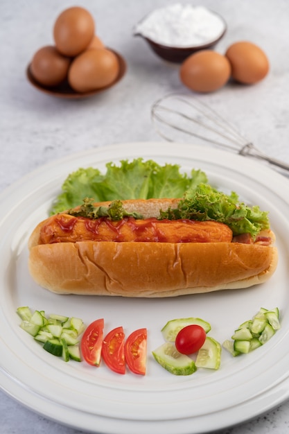 Free Photo sausage wrapped in bread and lettuce topped with sauce.