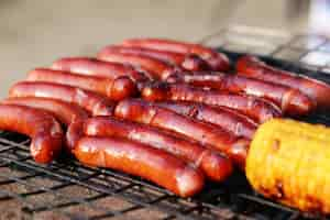 Free photo sausages and corn on the grill