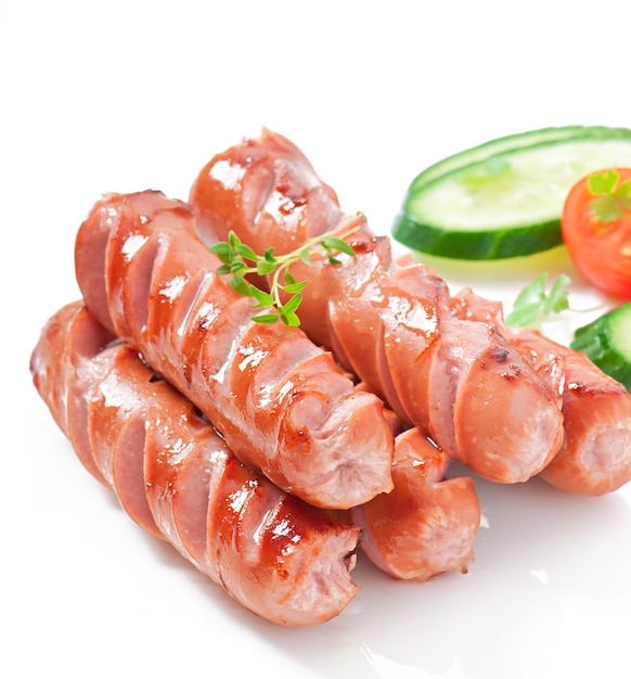 sausages on the grill and salad