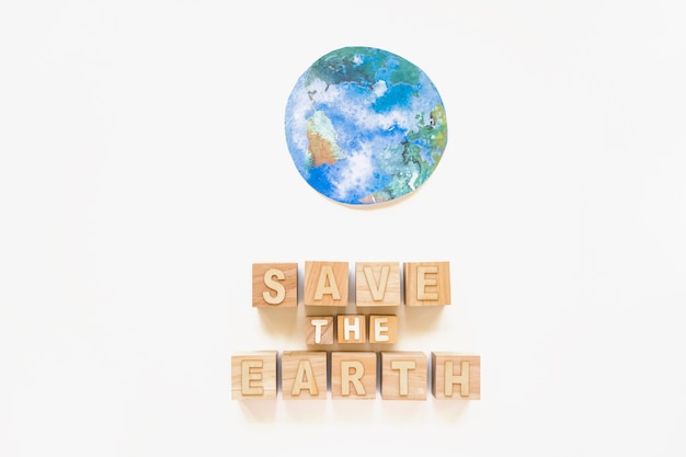 Free photo save the earth words and paper planet