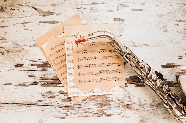 Free Photo saxophone and sheet music