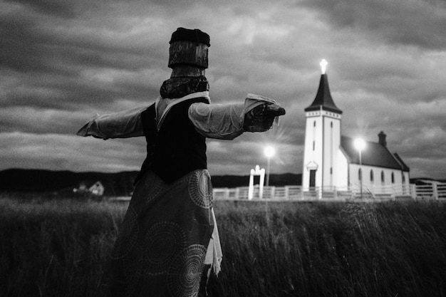 Scarecrow in a field in black and white