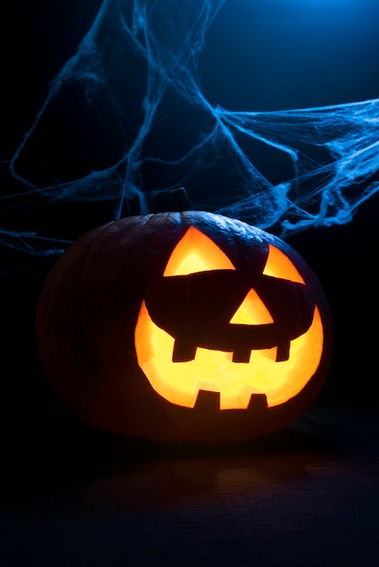 Scary halloween pumpkin with spiderweb