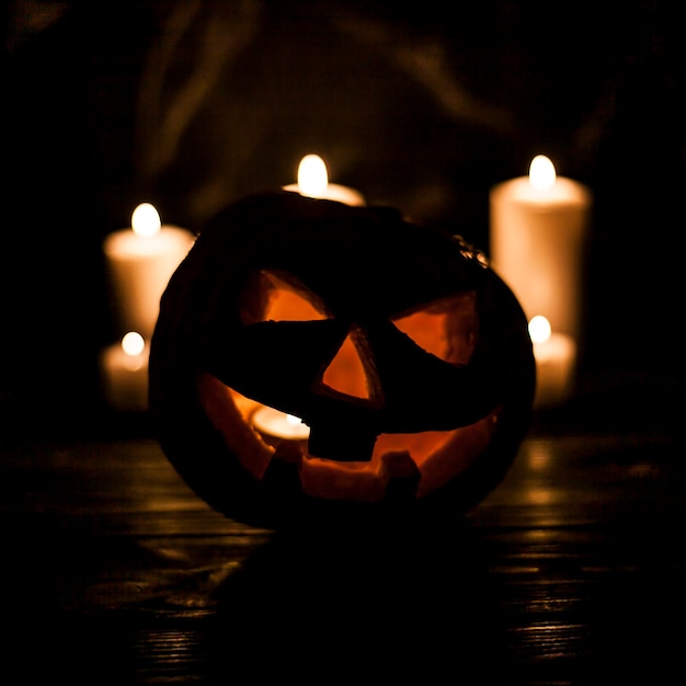 Free Photo scary illuminated carved pumpkin